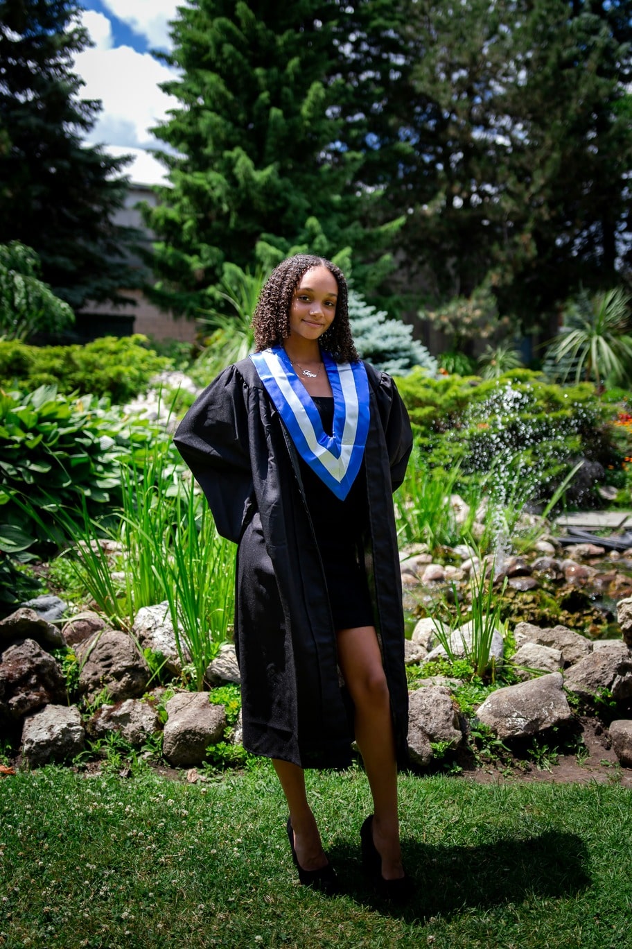 Black woman in graduation clothes during daylight