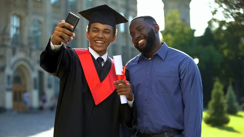 Photo of a graduate with his dad