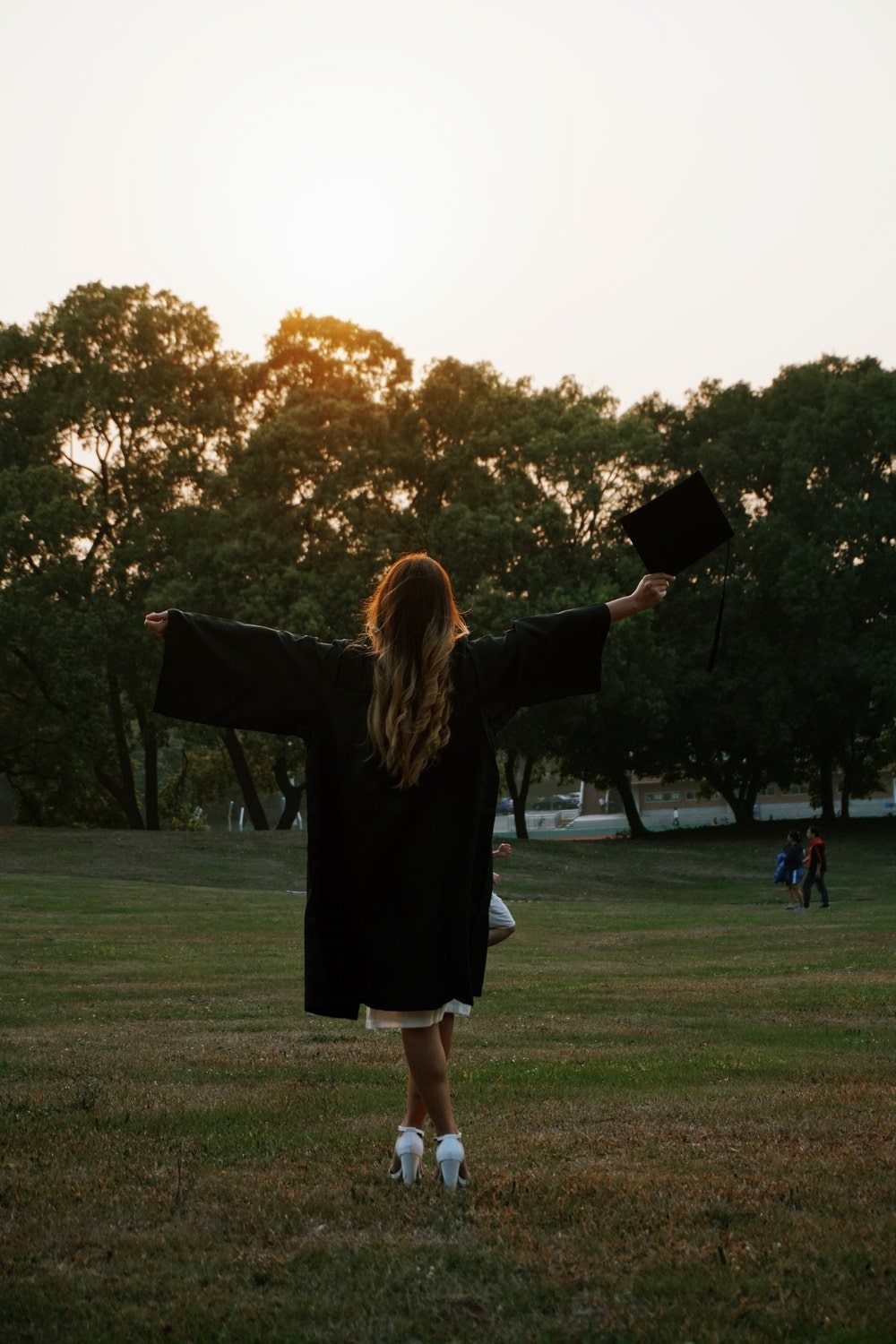 Babe posing on university campus at golden hour