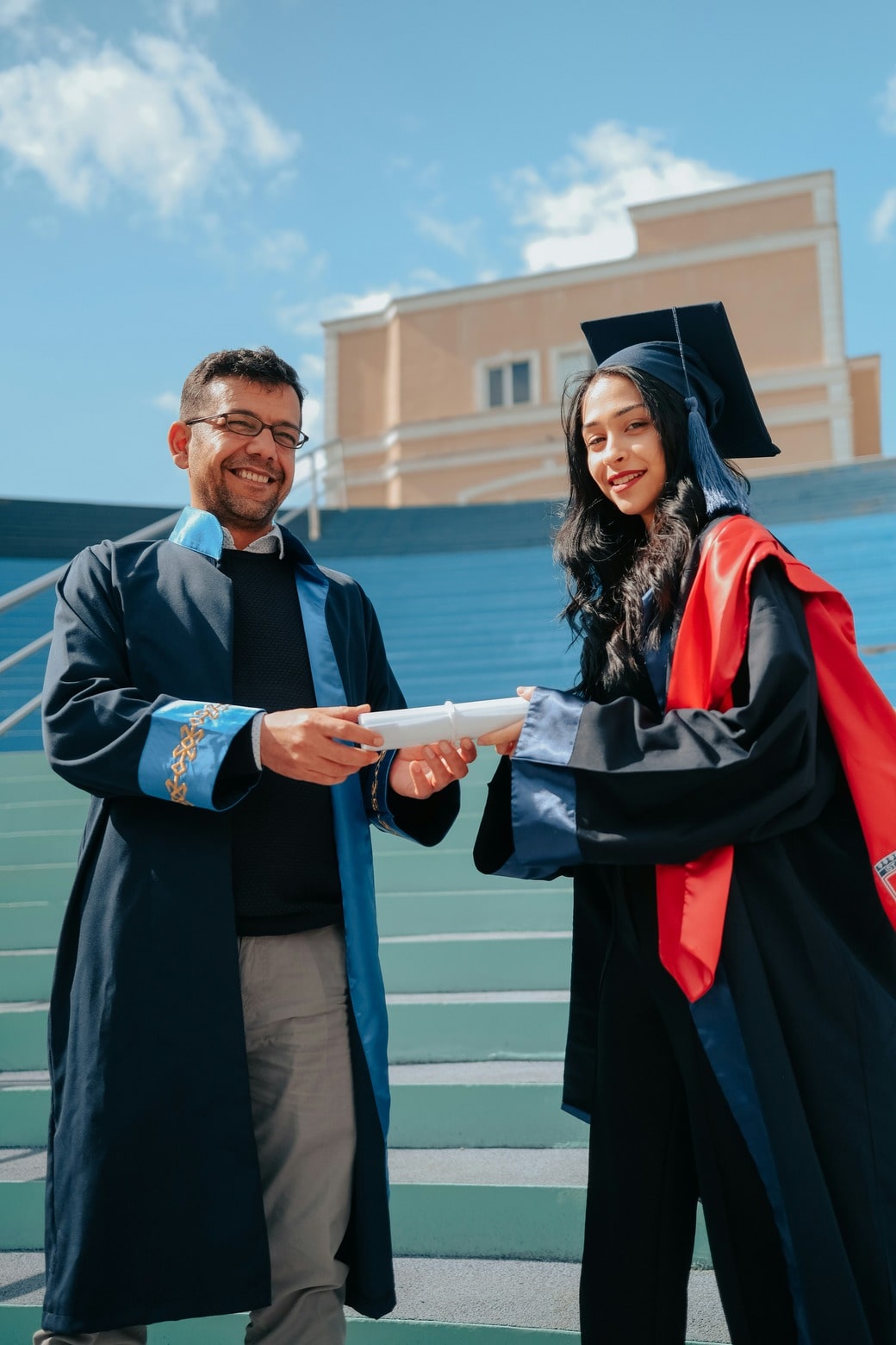 Photo of a graduate with her teacher