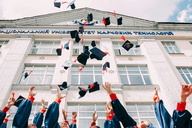 Graduation celebration throwing hats in the air